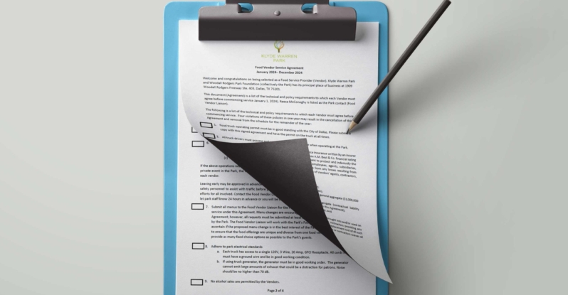 A clipboard showing the Klyde Warren Park Food Service Agreement